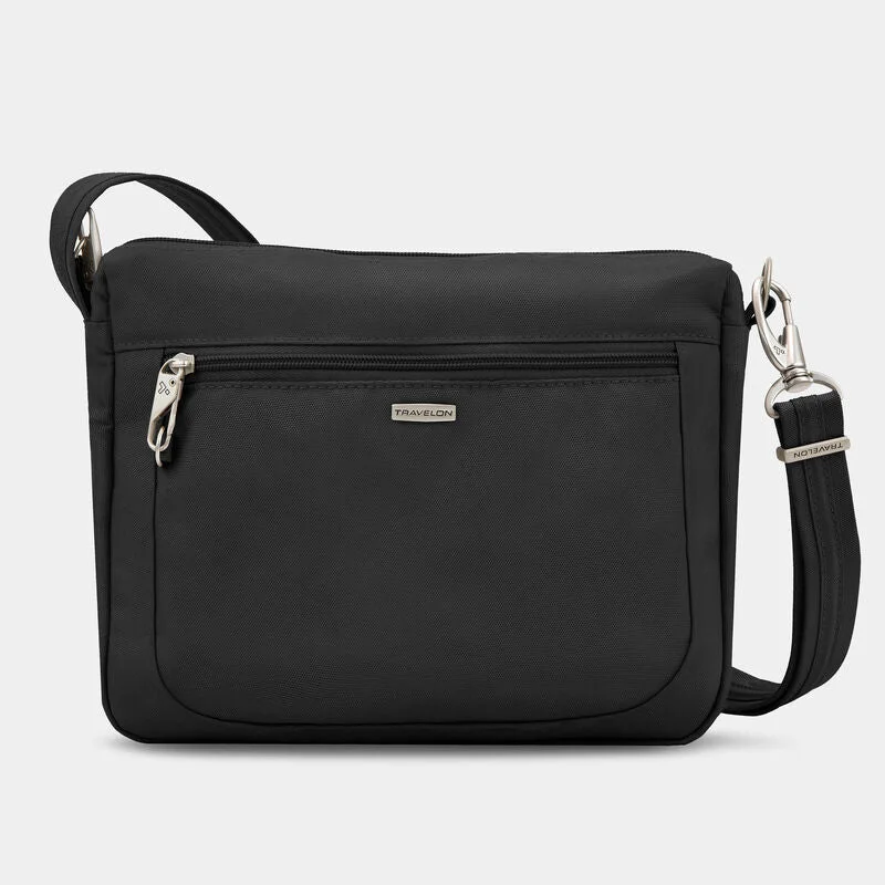 Men's leather crossbody bag with antique brass hardware for a vintage lookTravelon Anti-Theft Classic Small E/W Crossbody