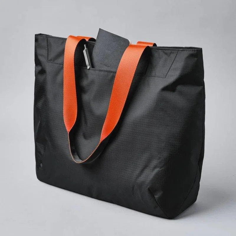 Compact carry - on travel bag with spinner wheels for easy maneuvering in airportsAlpaka Element Tote Compact carry - on travel bag with spinner wheels for easy maneuvering in airportsAlpaka Element Tote