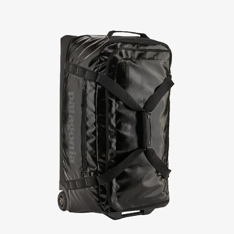 Garment - protected travel bag with hanging system for suits and dressesBlack Hole® Wheeled Duffel 70L