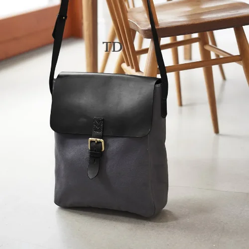 Compact carry - on travel bag with spinner wheels for easy maneuvering in airportsLeather and Canvas Messenger Bag