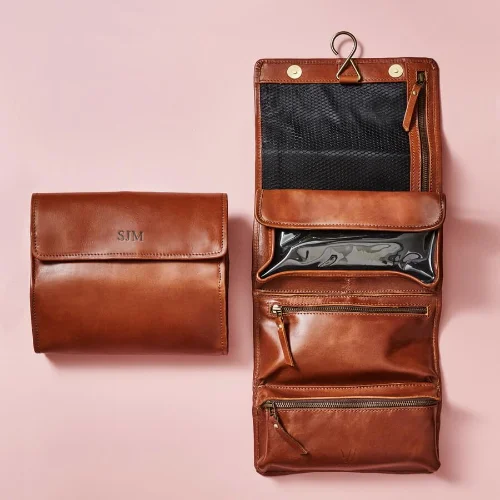 Garment - protected travel bag with hanging system for suits and dressesLeather Hanging Wash Bag